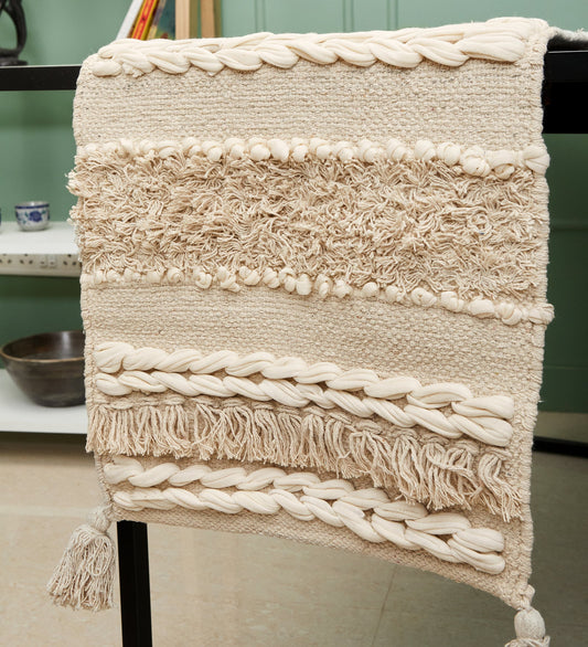 Soft knitted beige table runner with tassles